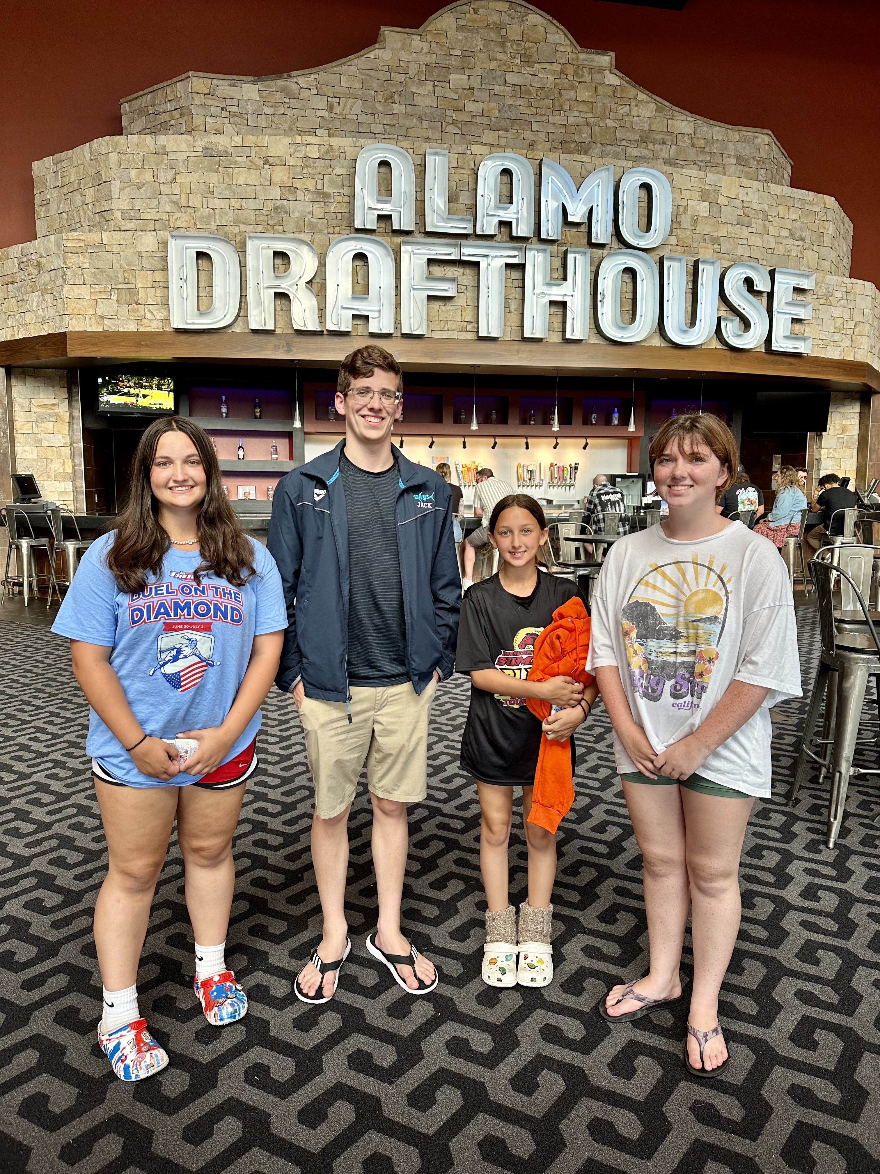 Heather and her kids at the Alamo Drafthouse movie theater